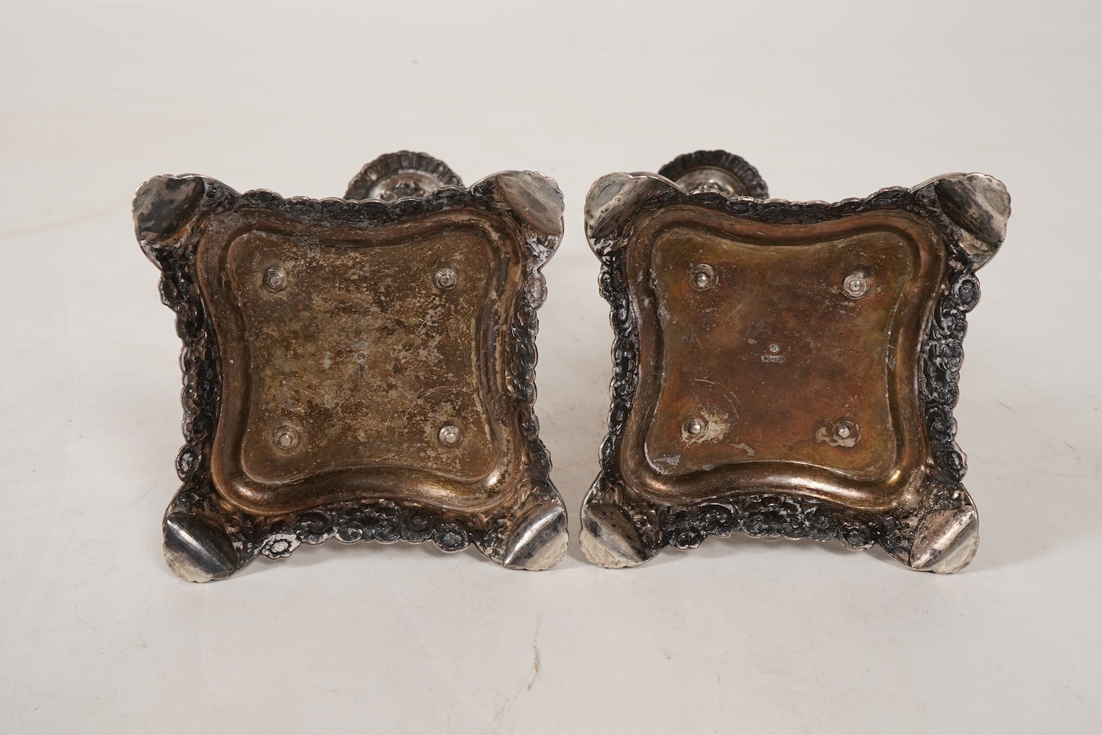 A pair of late 18th/early 19th century German white metal candlesticks, maker's mark W.C.H & S